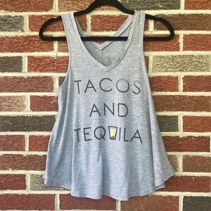 Tacos and tequila tank top. Size is a small. On the shorter side yet flowy.